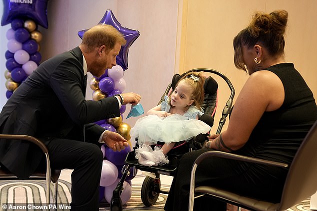 The Duke of Sussex speaks with six-year-old Esmee Mcglinchey at the awards last night