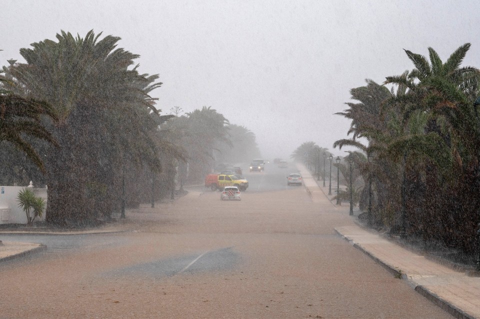 Rain floods a street in Teguise, Lanzarote.