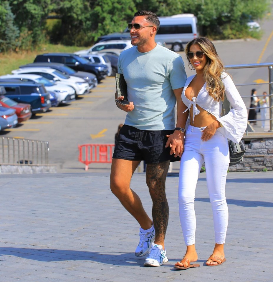 Couple holding hands and walking.