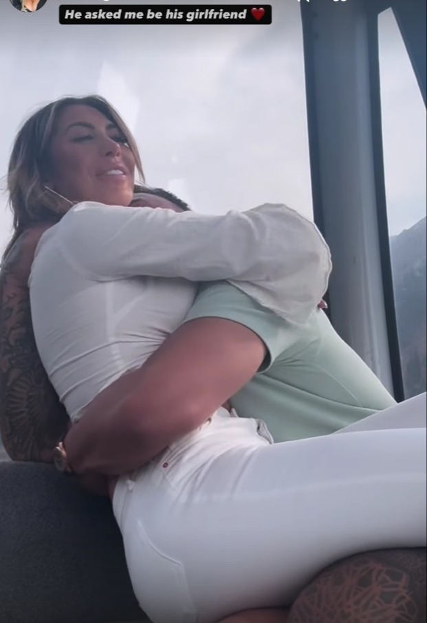 Couple embracing; he proposed.
