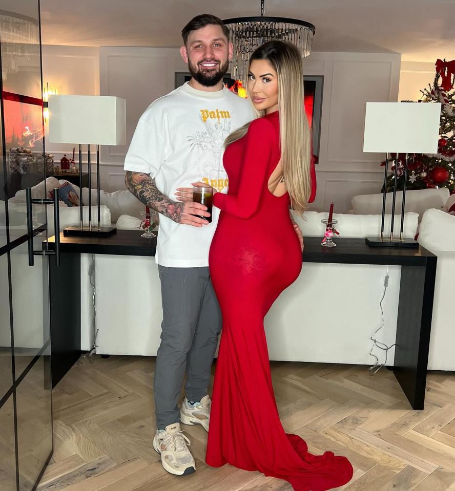 Chloe Ferry and a man posing together in a home.