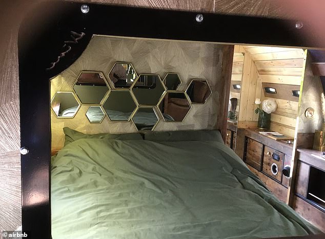 The first class compartment offers a double bed in plush surroundings, rich comfortable seating and soft lighting throughout