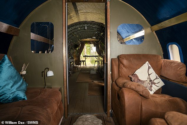 Mr Baker tells visitors they can 'step inside to the sleek contemporary interior of first class'