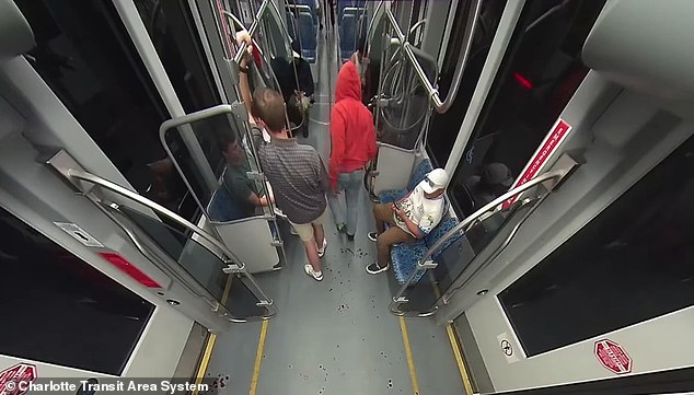 Brown was seen in the footage leaving a trail of blood throughout the train as other passengers appeared not to realize the killing had taken place