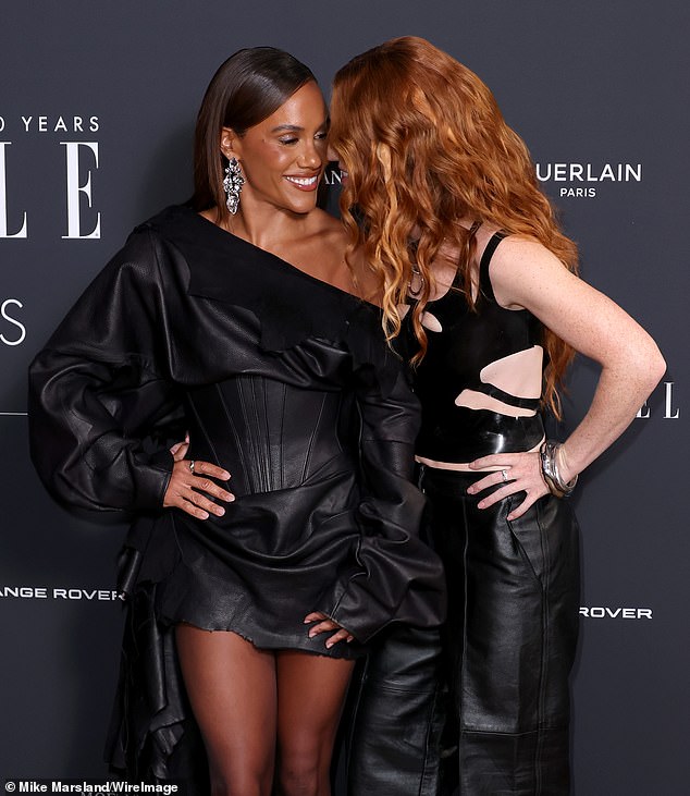 The TV presenter and singer wrapped their arms around each other and giggled as they posed for the cameras