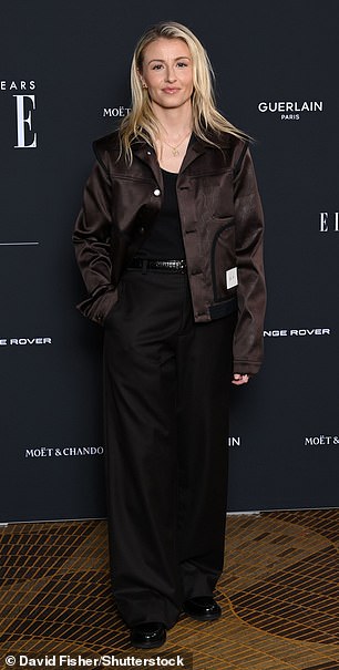 Leah Williamson oped for a more casual look in a black low cut top with matching trousers and boots