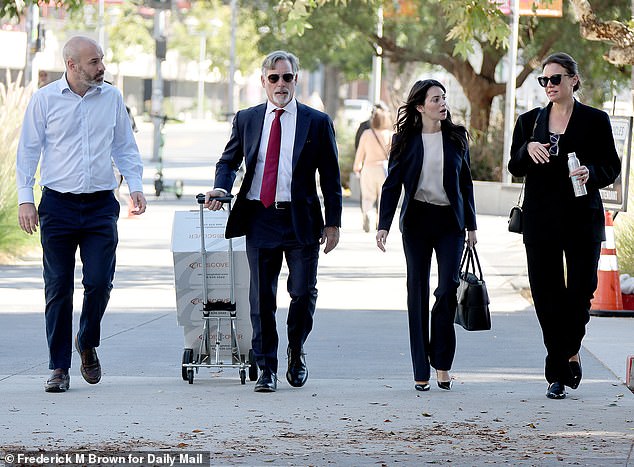 Zarini (far right) is seen outside the Los Angeles Superior Courthouse on Monday with her legal team, including her attorneys Gary (left middle) and Taylor B. Dordick (right middle)