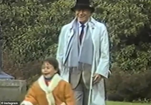 Zarini is seen as a child with her grandfather, Aldo Gucci, in an undated image