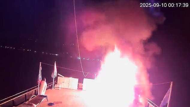 In dramatic footage shared online, a loud-pitched sound can be heard before an object lands on the boat and it bursts into flames