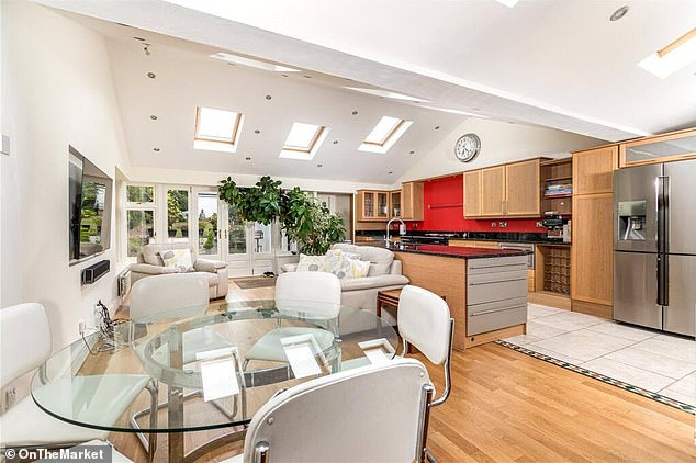 The pair bought the five-bedroomed semi in 2001 for £325,000 so stand to make a profit of £825,000 (pictured: the property's kitchen)