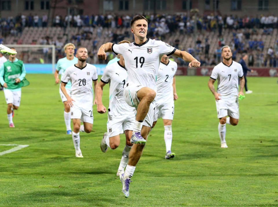Christoph Baumgartner of Austria celebrates a goal during a soccer match.