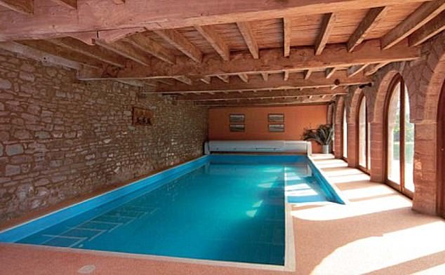 A swimming pool (pictured) is currently housed in the barn where Hammond lives