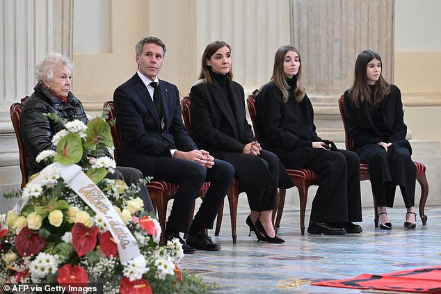 Maria Pia di Savoia (L), Emanuele Filiberto (2nd L), Clotilde Courau (C), with their daughters Princesses Vittoria and Luisa Savoia sit near the coffin of Vittorio Emanuele di Savoia as he lies in state on the eve of his funeral ceremony in Saint Hubert Chapel in the Reggia of Venaria Reale, near Turin, on February 9, 2024