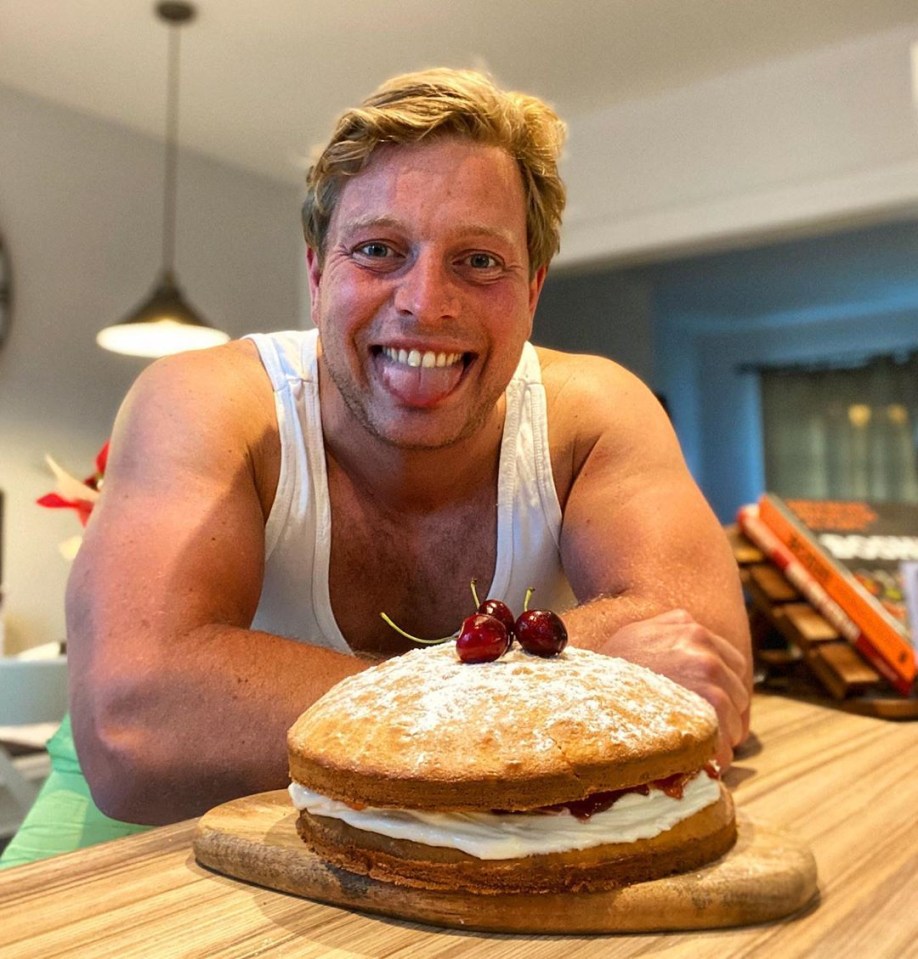 Thomas Skinner with a large Victoria sponge cake.