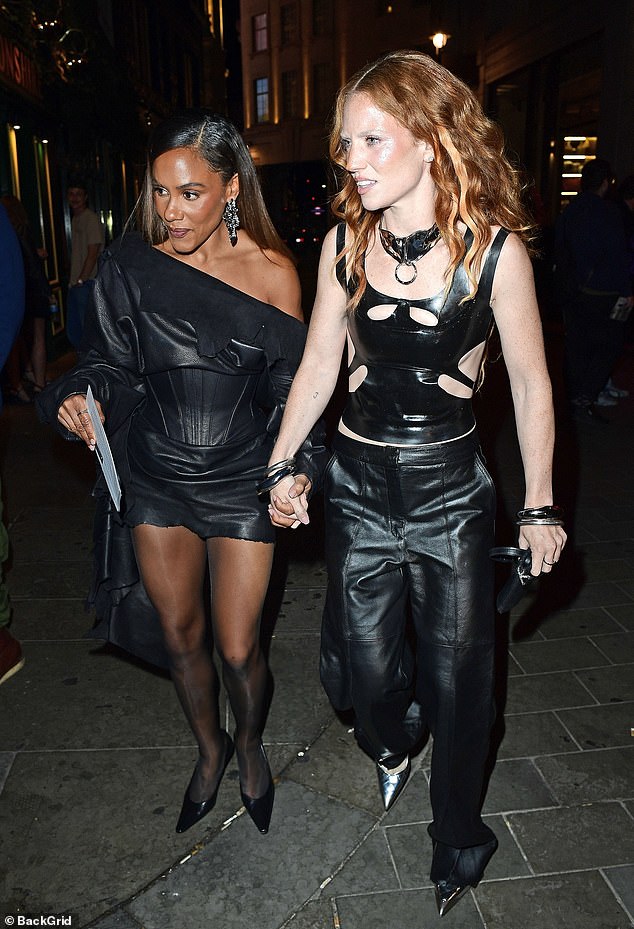Meanwhile, football pundit Alex, 40, left the venue holding hands with her singer girlfriend Jess, 35, as they opted for coordinating latex looks