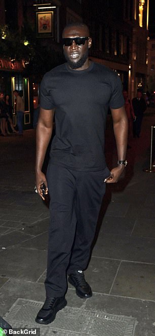 Stormzy opted for a simple black T-shirt look and trousers with trainers