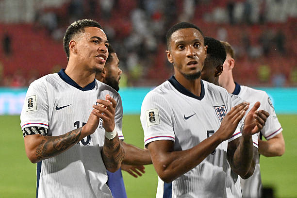 England's Morgan Rogers and Ezri Konsa clapping after a soccer match.