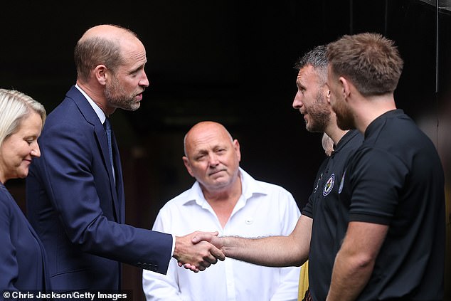 William talks to Jesse Lewis, father of Jac Lewis, during his visit to Cardiff this afternoon