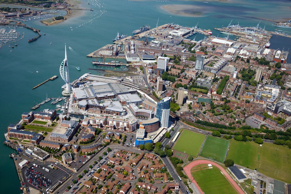 Aerial view of Portsmouth, England, featuring the Spinnaker Tower and Gunwharf Quays.