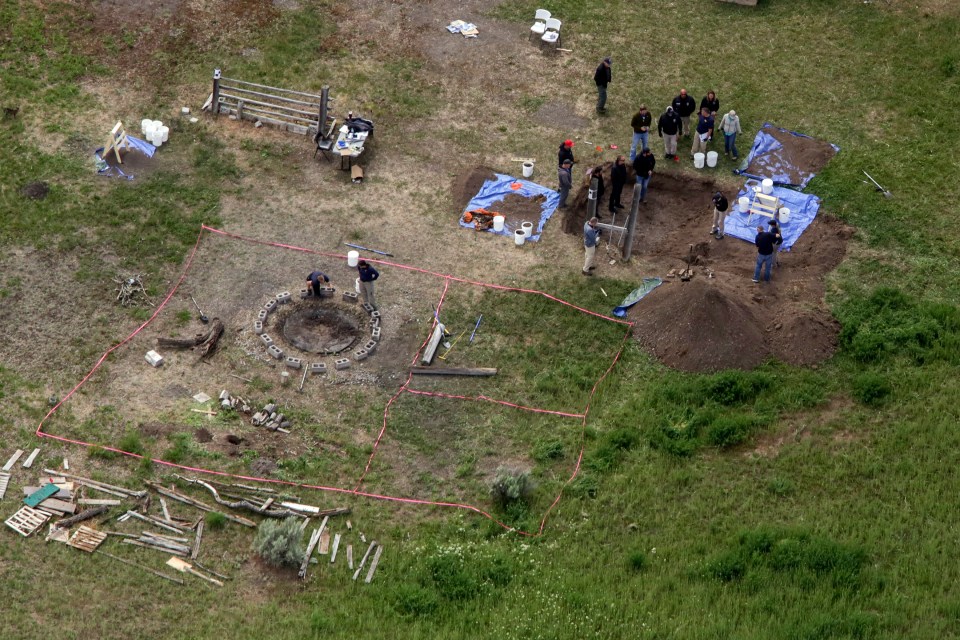 Aerial view of investigators searching for human remains.