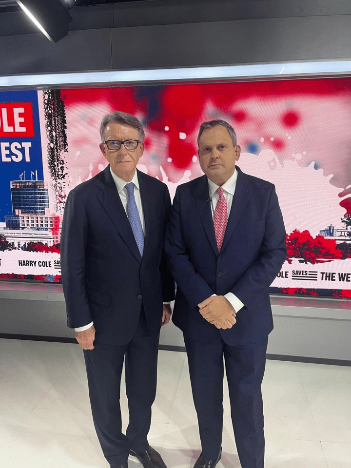 Two men in suits standing together.