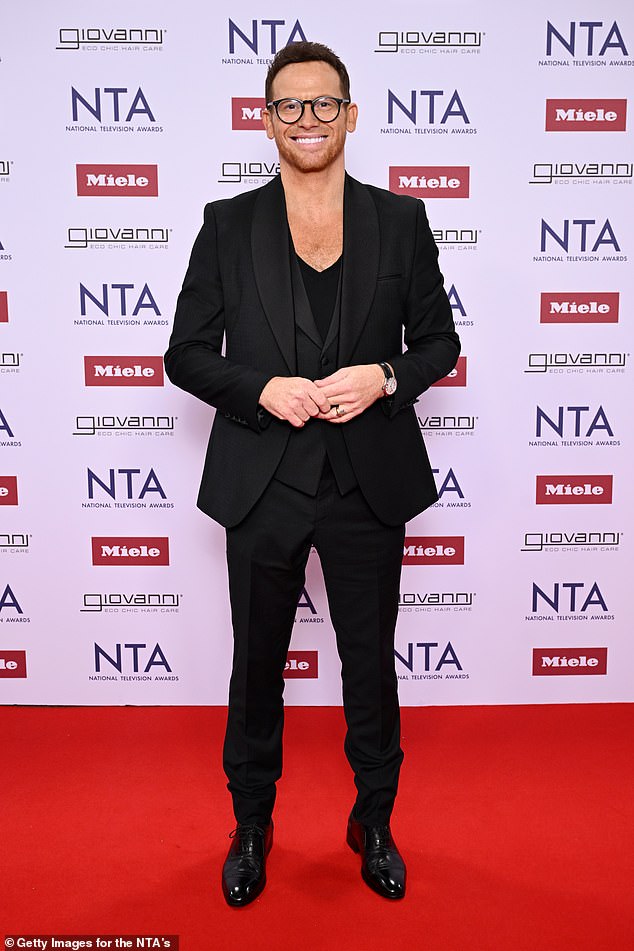 Husband Joe Swash followed closely behind, looking dapper in an all black ensemble