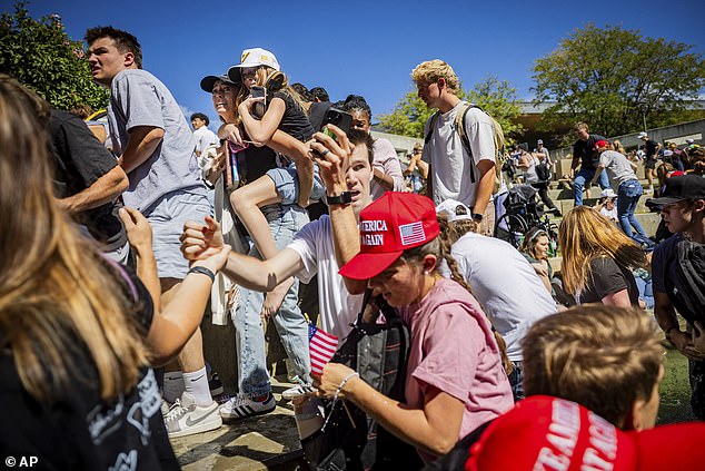 The crowd reacts after Charlie Kirk, the CEO and co-founder of the conservative youth organization Turning Point USA, is shot at the Utah Valley University Wednesday, Sept. 10, 2025, in Orem, Utah. (Tess Crowley/The Deseret News via AP)