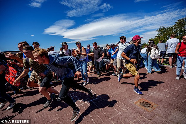 People run after a shot was fired at U.S. right-wing activist and commentator Charlie Kirk during a Utah Valley University speaking event in Orem, Utah, U.S. September 10, 2025. Trent Nelson/The Salt Lake Tribune via REUTERS.     NO RESALES. NO ARCHIVES. THIS IMAGE HAS BEEN SUPPLIED BY A THIRD PARTY
