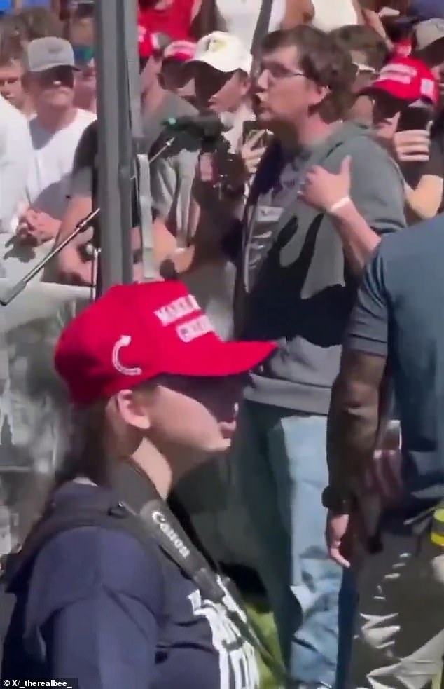 A member of the crowd (pictured) stepped up to the microphone to debate Kirk, who was sitting under a tent, on the matter of mass shootings .