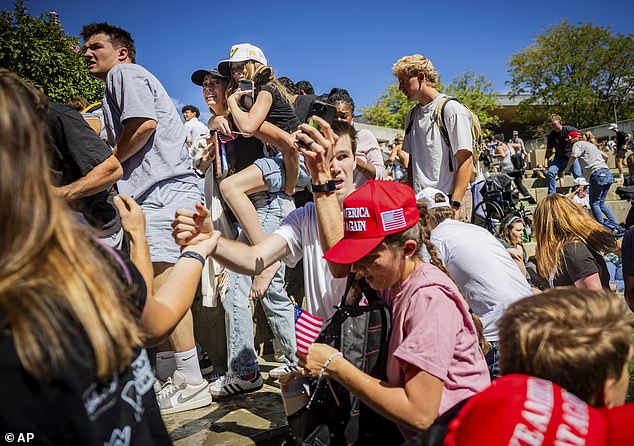 Conservative activist Greg Adams was also at the event, when he heard the single deadly shot - and described the gory aftermath as nothing short of shocking while recalling the pools of blood all over the area (pictured: attendees running after gunshot)