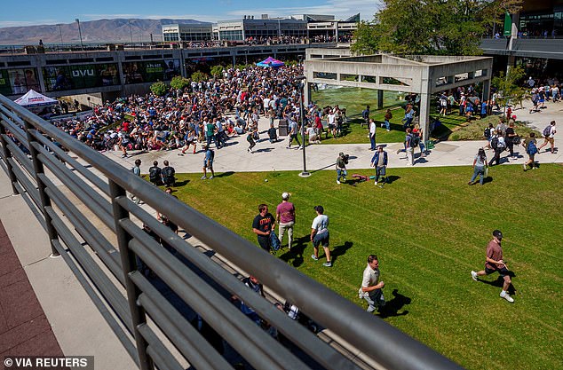 Students at the event were seen running and screaming in shock after witnessing the bloody scene unfold in front of their eyes (pictured)