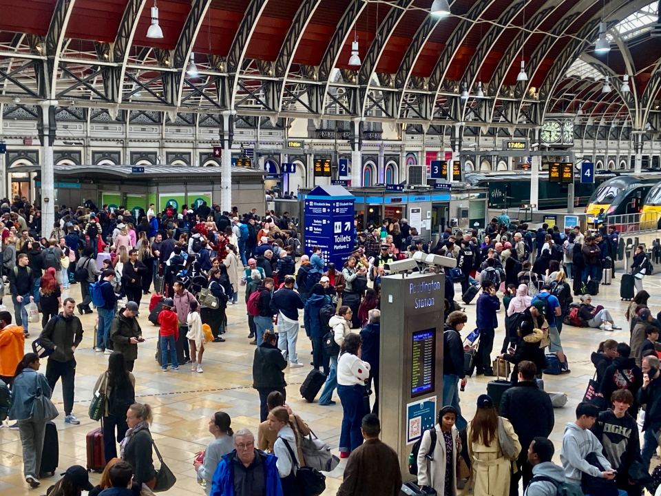 Crowded Paddington Station with cancelled trains.