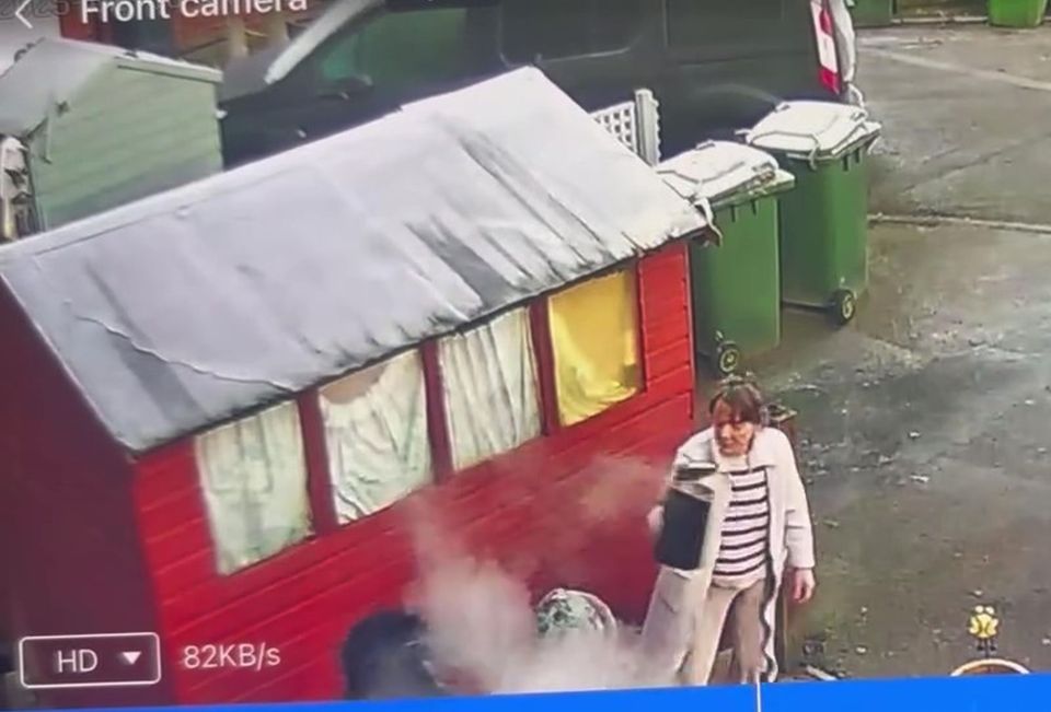 Security camera footage of a woman throwing boiling water.