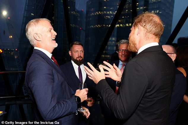 Prince Harry speaks with Al Carns Minister for the UK Armed Forces (L) & Ruslan Prykhodko, Deputy Minister of Ukrainian Veterans Affairs