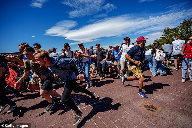 Horrified attendees fled the scene as chaos unfolded (pictured)