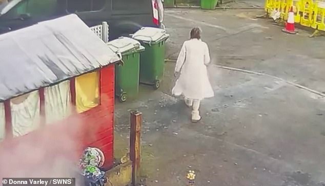 Ina is seen walking away after chucking the kettle full of boiling water over her neighbour