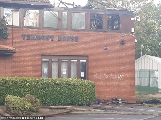 The words '328 days blood on your hands' were scrawled on the walls of the building