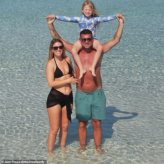 The family spent seven months planning how to make the trip a reality, which included leaving their rented home to live with Lewis's parents for half a year to save as much money as possible. They are pictured enjoying a day out at the beach