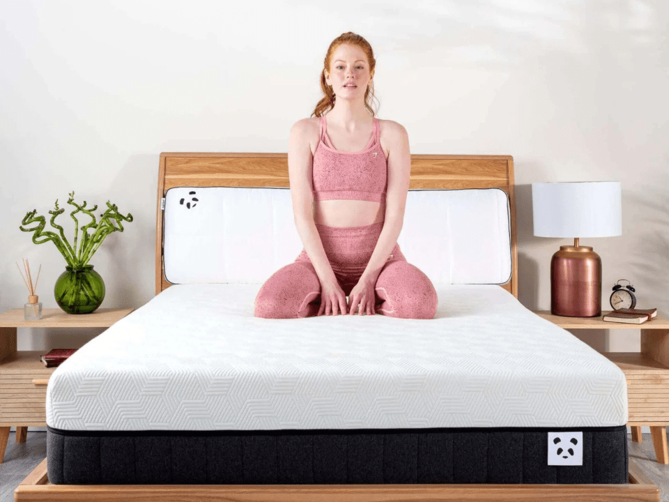 Woman sitting on a mattress.
