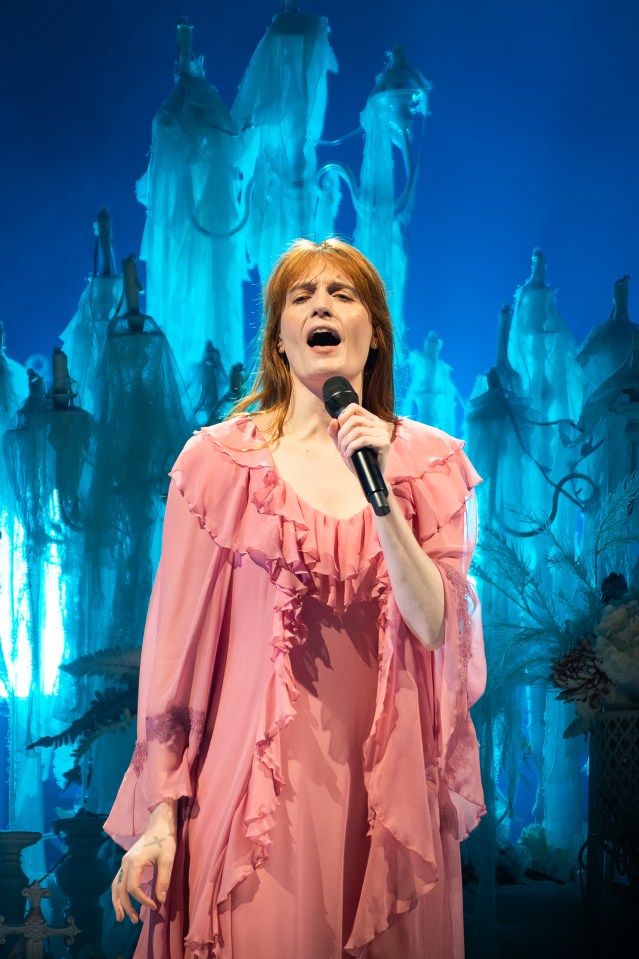 Florence Welch of Florence + the Machine performing on stage.