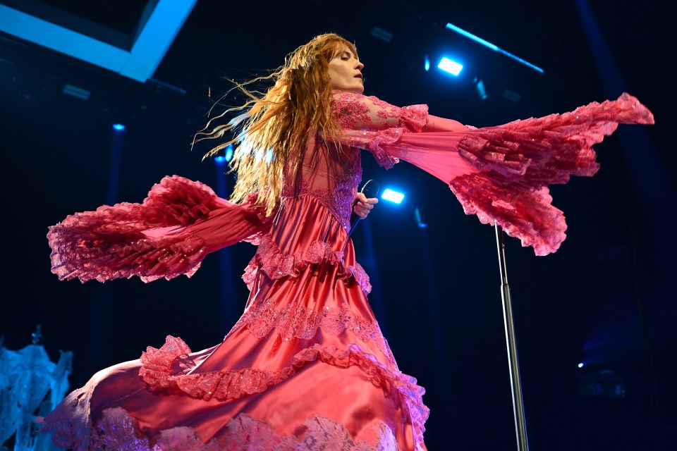 Florence Welch of Florence + The Machine performing on stage.