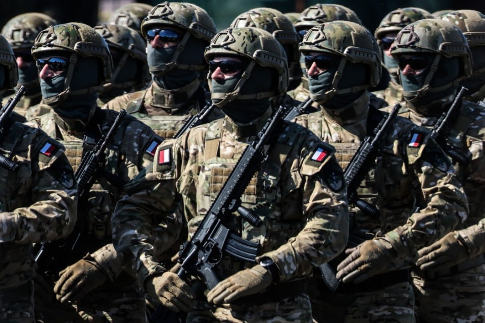 Troops attend a military parade under the name 'Strong White-Red' on Polish Armed Forces Day in Warsaw, Poland on 15th August, 2023. About 2,000 troops from Poland and other NATO countries took part, accompanied by 200 pieces of military equipment and 92 aircraft. The parade was held on the anniversary of the 1920 Battle of Warsaw, in which Polish troops defeated Russian Bolshevik forces. (Photo by Beata Zawrzel/NurPhoto via Getty Images)