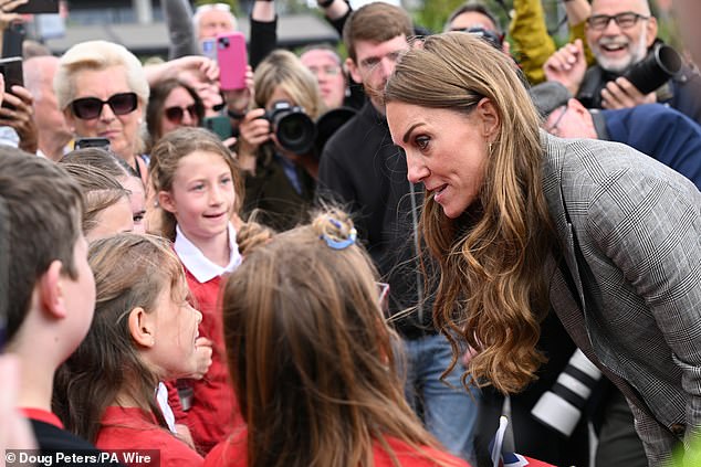 Kate smiled as she spoke with kids after wrapping up her first visit of the day, in Suffolk, this afternoon