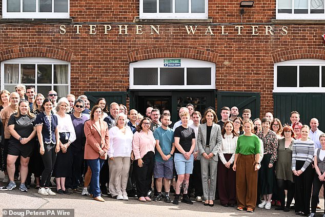 The Princess, pictured, posed for a group photo with the staff at Sudbury Silk Mills this afternoon