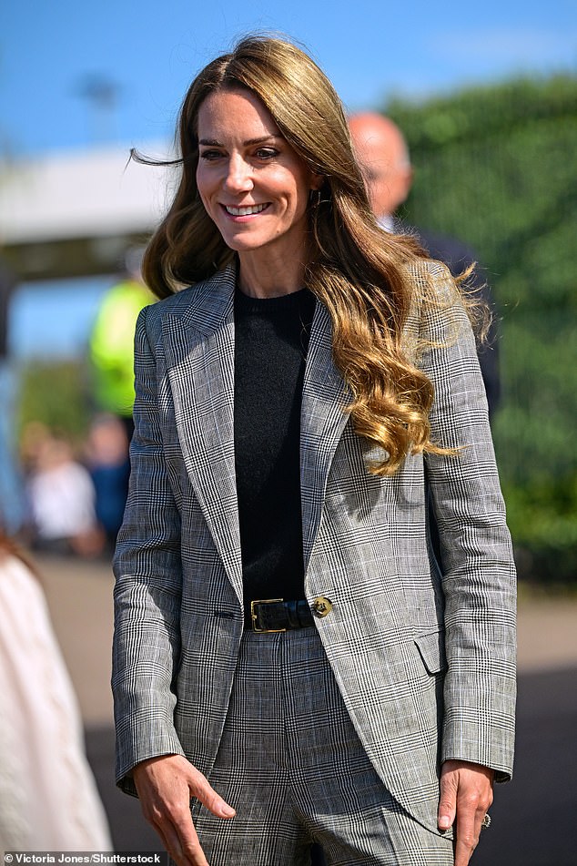 Kate, pictured, opted for a simple leather belt and black jumper to let the print do most of the talking