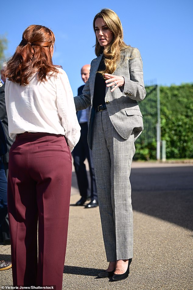 Kate showed off her sense of style as she donned a grey trouser suit during the visit this morning