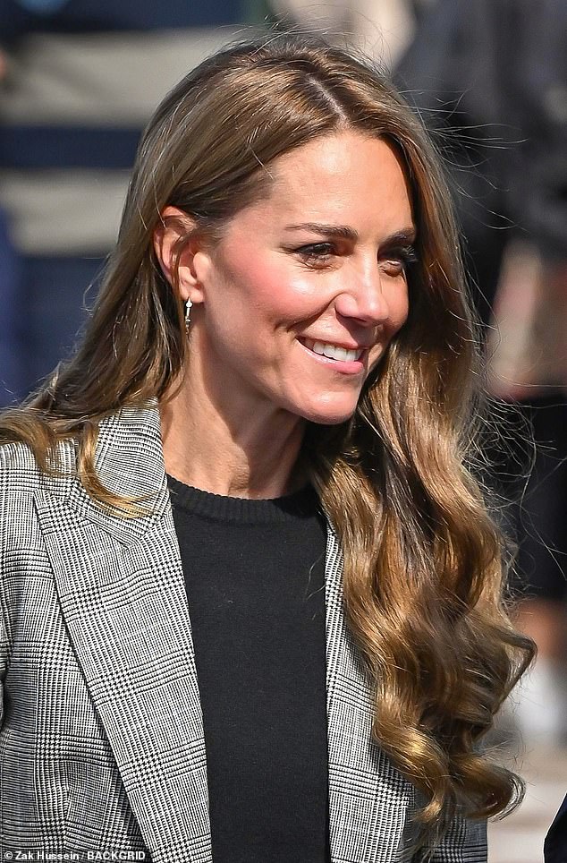 The look was perfectly autumnal, as the Princess teamed a black jumper with a patterned blazer and trousers