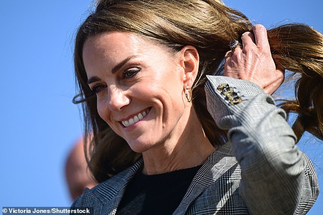 Kate's hair was golden in the sun, as she also opted for minimal jewellery to accentuate the ensemble