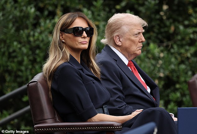 President Donald Trump (right) and First Lady Melania Trump (left) take in the 9/11 commemoration at the Pentagon Thursday