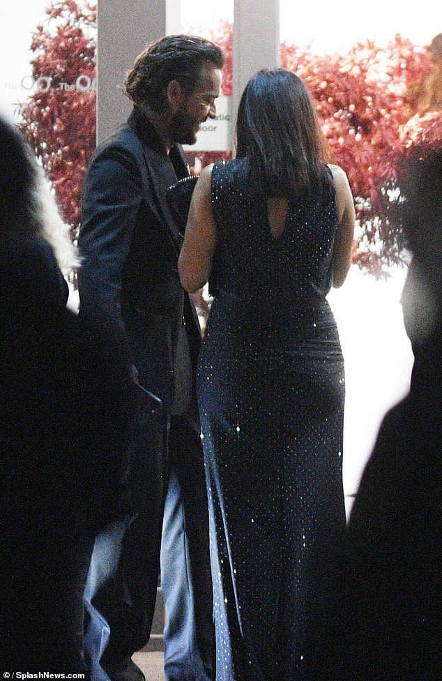 The woman was dressed in a dazzling navy gown and heels